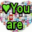 A four- of pixelated text and symbols with heart icons, featuring green 'You are' text, white 'the music' text, and pink 'in me' text on distinct backgrounds