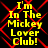 Yellow text reading "I'm In The Mickey Lover Club!" on a black background with red geometric lines, displayed in a of four identical
