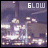 Pixelated image with 'GLOW' text above a blurred cityscape at night, showing faint light intensity changes across six