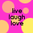A static image with a bright pink background featuring overlapping yellow and orange circles, displaying the text "live laugh love" in black pixelated font.