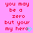 Pixelated red text on pink background reads 'you may be a zero but your my hero' with cyan heart symbol replacing the final letter of 'hero'.