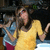 Two figures in a pixelated image: one in a yellow dress with arms raised, another in blue and red clothing with an outstretched arm.