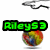Green text 'Riley53' in blocky font with black outline appears above a multicolored sphere on white background, with motion blur effects on the sphere and text.