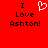 Red background with black text reading "I Love Ashton!" and a white pixelated heart symbol replacing the word "love" in one instance.