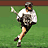 Pixelated image of a person in athletic gear holding a lacrosse stick on green grass, with blue background text reading C-PEP LAX #24.