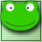 Green frog face with white eyes and black pupils, smiling expression on a light green background