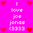 Pixelated pink background with red hearts and white text reading 'I love joe jonas <333' arranged in a pattern
