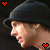 A person in a black beanie with a red heart icon in the top-left corner and a white heart icon in the top-right corner, shown in four with varying heart icon colors