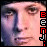 Pixelated face with two distinct expressions, side-by-side, with vertical text on the right edge.