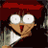 Pixelated anime-style character with red hair and wide eyes holding a white object, next to text reading 'Anime IM' and 'cOm' on black background.