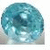 A pixelated blue text "December" next to a teal and white circular object with gradient shading on a gray background.