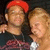 Two people pose together; one wears a red cap and dark shirt with red patterns, the other has light hair. The right person's head position shifts slightly between frames.