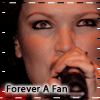 A person singing into a microphone with a hand covering the mouth, text reading 'Forever A Fan' at the bottom, and a black background with white dashed lines.