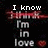 Pixelated text reads "I know I'm in love" over a dark background with red and green pixel noise.