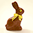 Pixelated chocolate bunny with yellow ribbon against light background, next to bright yellow with orange 'YUM!!!!!!' text