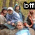 Group of people in outdoor setting with one person holding a large blue ball, text 'bfr' visible at top center.