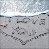 Beach scene with 'I LOVE YOU' written in sand, a starfish on the left, and waves in the background.