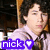 Pixelated image of a person with dark hair wearing a light-colored shirt, with a purple banner displaying 'nick' and a white heart symbol at the bottom.