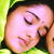 Static 50x50 pixel icon showing a close-up of two people kissing with closed eyes, rendered in low-resolution pixel art style against a green background.