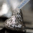 A pixelated image of a chocolate kiss with silver foil, split into four quadrants with text in red pixel font.