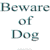 Pixelated image split into two sections: left side displays text 'Beware of Dog' on gray background, right side shows dog with brown and white fur against blue sky.