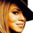 Static 48x48 pixel icon showing a close-up of a person with long blonde hair wearing a black cap, rendered in low-resolution pixel art style with warm orange and yellow tones.