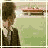 Animated sequence of a character in brown suit and tie against green background with red structure, showing head movement and text changes.