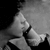 Black-and-white image split into two sections: left shows a person with hand near face, right displays text "When you look me in the eyes.".