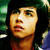 Pixelated image of a person with dark hair and green eyes, next to text reading "Munro Chambers is amazying" on black background.