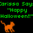 Green text on black background reads 'Carissa Says "Happy Halloween!!"' with three orange pixelated cats in walking poses. A gray rectangle partially obscures the right side of the image.