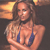 A pixelated image shows a person with long brown hair wearing a blue bikini top, standing against a dark background with a yellowish light source on the left.