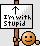 Pixelated sign with black arrow pointing up and text "I'm with Stupid" held by a smiling orange-brown cartoon character.