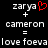 Pixelated text and symbols on black background with red heart symbol above 'zarya' in left