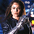 A pixelated contact sheet showing two frames of an animated icon featuring a woman with long dark hair and a green text logo on the right side.