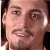 Pixelated close-up of a person's face showing eyes, nose, mouth, and partial hair, with visible pixelation and color blending.