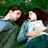 Four show two people in various poses: lying together outdoors, sitting close indoors, and kissing in formal attire