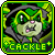 Pixelated green cartoon character with glowing eyes and pink mouth, wearing dark hooded cloak against black background.