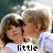 A pixelated image of two people in a close embrace, with text changing across frames from 'little' to 'lovers' to '<3'.