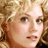 A 48x48 pixel buddy icon featuring a contact sheet layout with two visible frames: top-left shows a blonde woman's face, and bottom-left displays the Warner Bros. logo; right side is empty gray space.