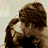 A 48x48 pixel buddy icon featuring a couple kissing on the left side and text reading "i love his sweet kisses" in pixelated font on the right, displayed as part of an animated contact sheet with two frames.