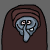 Pixelated cartoon witch with blue face and brown hooded cloak, two expressions showing closed eyes and open mouth with teeth.