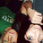 Three figures in a pixelated style: one with brown hair and dark clothing, two others with light skin tones and white tops against green and blue backgrounds.