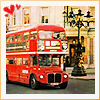 Red double-decker bus on city street with building facade and streetlamp, three red heart icons in top-left corner.