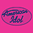 Pink background with oval logo reading 'American Idol' on left and three figures seated at a table on right.