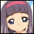 A pixelated anime-style character with purple hair and a pink headband on the left, next to black background text reading "Anime IM" above smaller "com" text on the right.