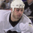 A 48x48 pixel buddy icon featuring a hockey player in a white jersey with black accents, the Pittsburgh Penguins logo, and text reading "Rico Fata #9" on a gray background.