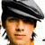 A pixelated image of a person wearing a gray flat cap with dark stripes, next to red text reading 'My boy!!' on black background.