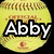 A yellow softball with brown stitching and a red logo, featuring the name "Abby" in large white text on one side.