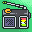 Pixel art contact sheet showing two frames of an animated icon featuring a gray boombox with purple speaker grilles, orange turntable, and rainbow-striped display against a green background.