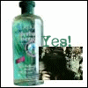 A bottle of green liquid with a blue label sits beside a small image showing a person with dark hair and a black top, with 'Yea!' text above.